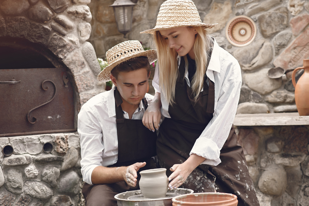 couple-with-brown-aprons-making-vase.jpg